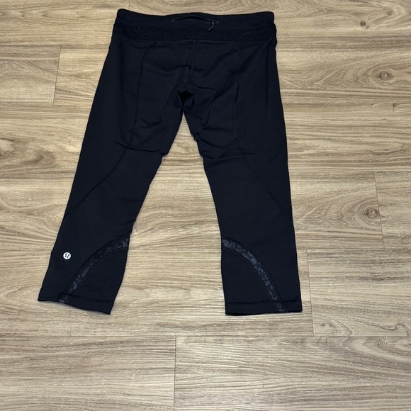 Lululemon Size 8 Black Inspire Crop Leggings with Lace - Picture 2 of 5